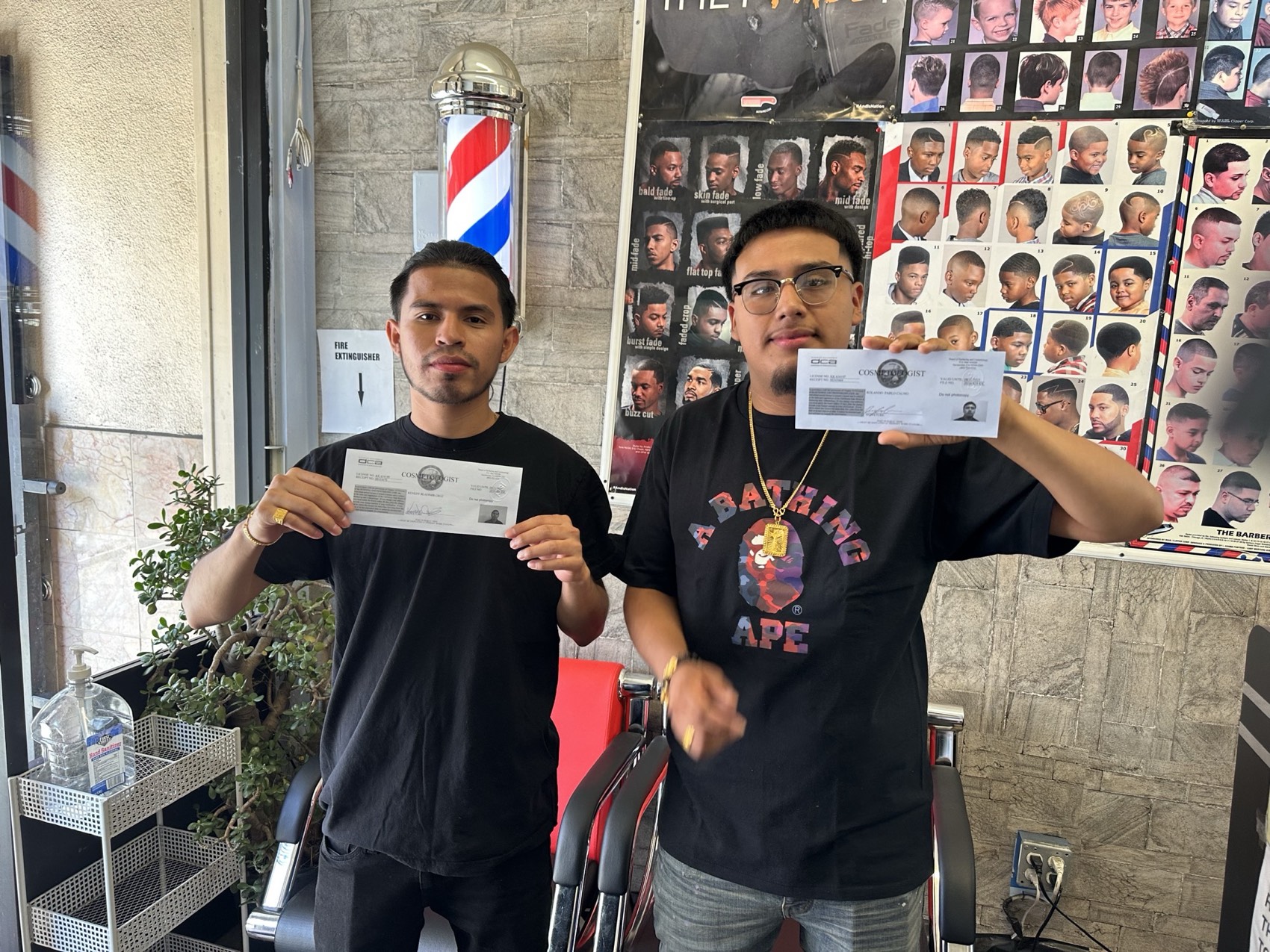 Two BSBCA graduates holding their California licences